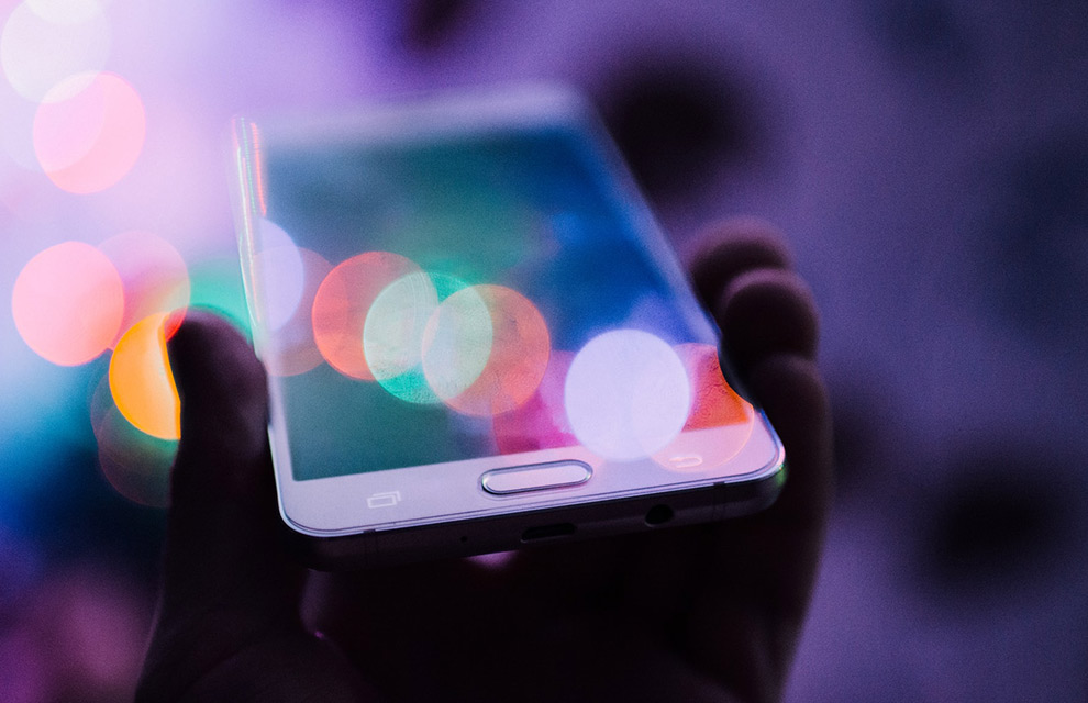 mobile phone mirroring lights symbolizing the future of cashless payments